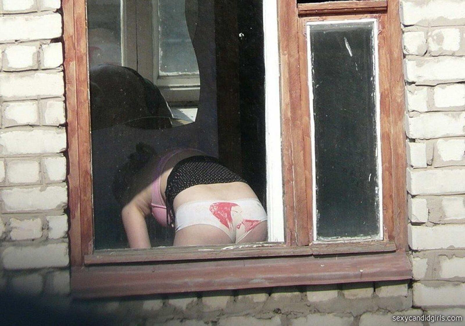 Mature milf in the window