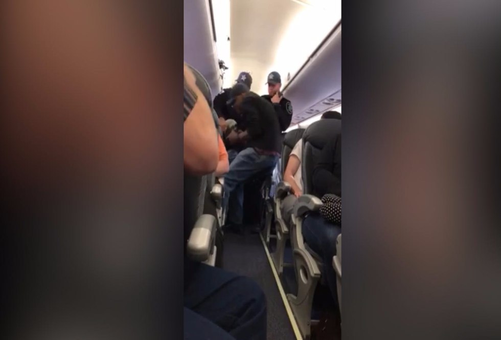 People sleep on an airplane