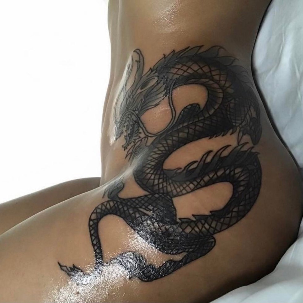 Naked women with a private tattoo