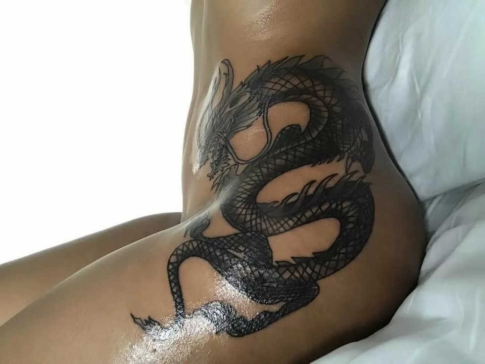 Naked with a dragon tattoo