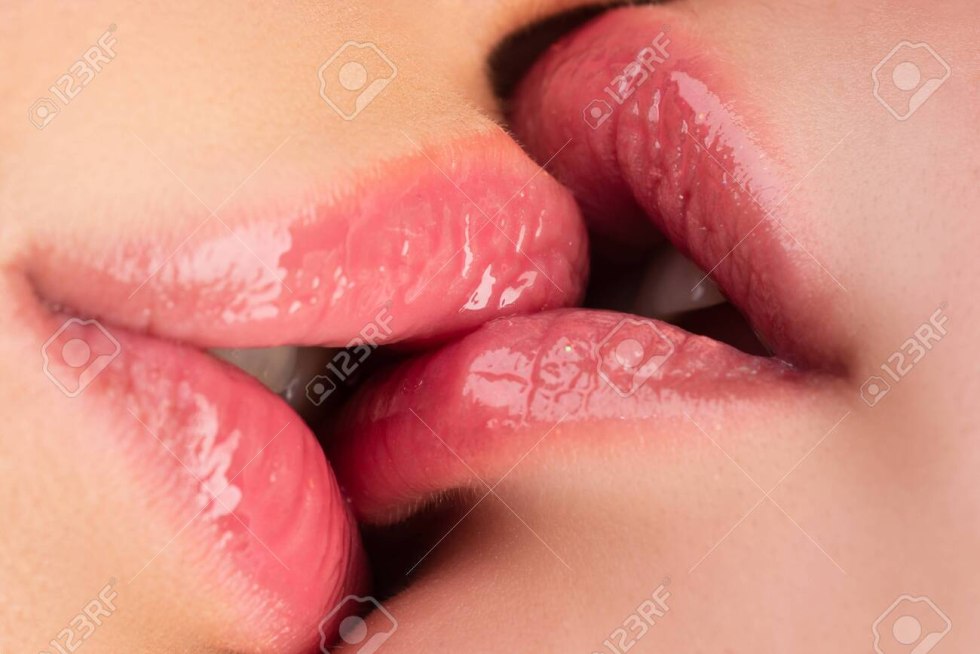 Lesbian kiss on the lips with the tongue before