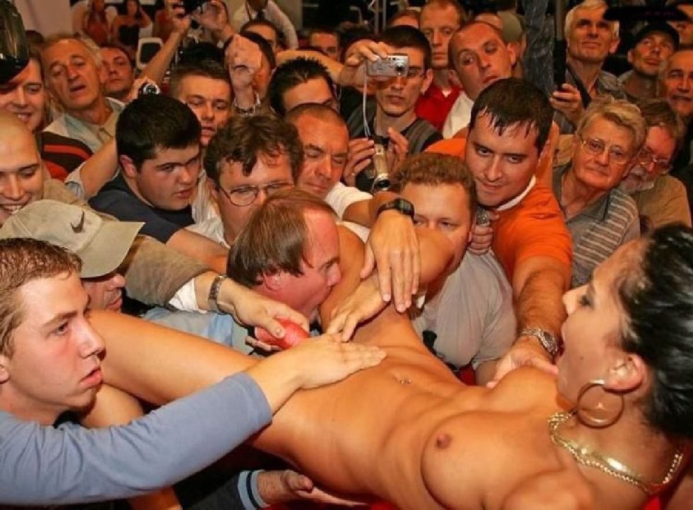 Naked guy in front of the crowd