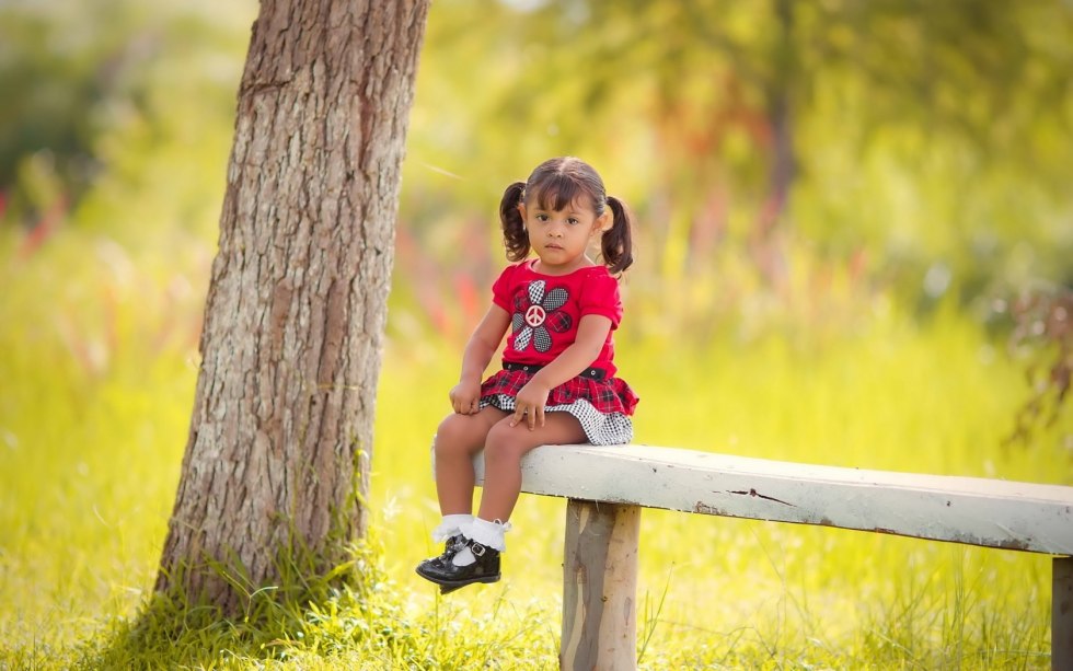 Girl sits on a bench
