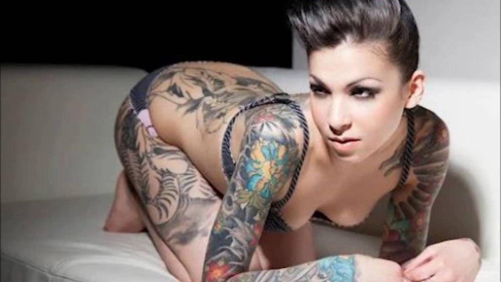 Tattoo on the hip on the beach