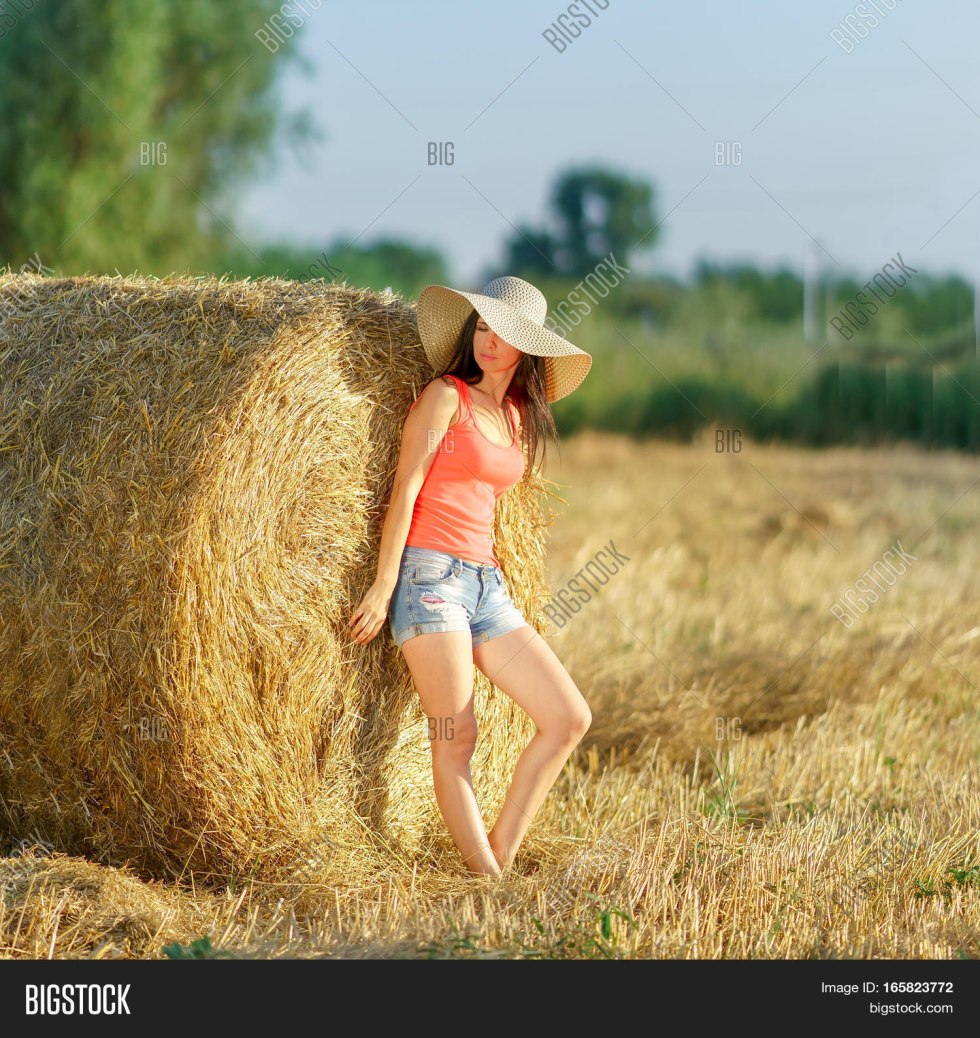 Girl on a stack of straw