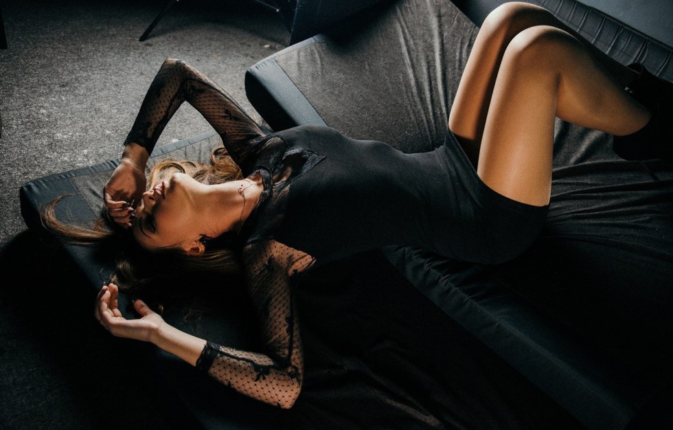 Girl brunette in a black dress