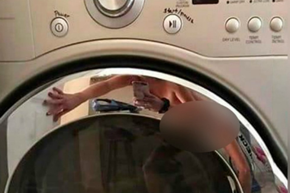 Girl in the reflection of the washing machine
