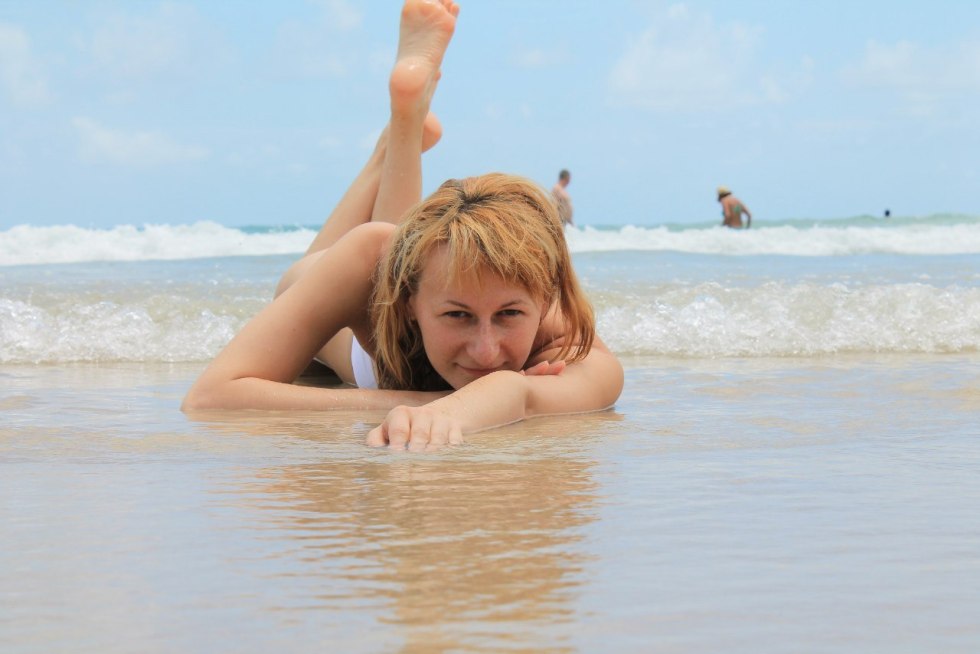 Anna Kovalchuk runs along the sand to the ocean