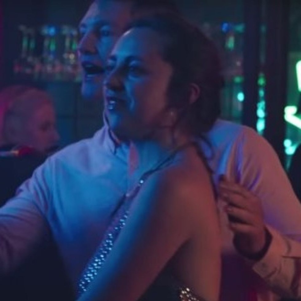 Photo of a girl with the hands of men under a skirt