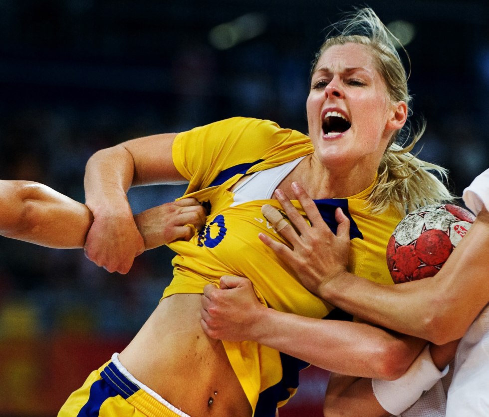 Beach volleyball players in thongs