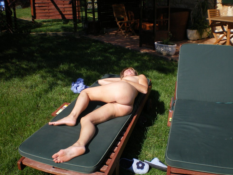 Sunbathes in the country