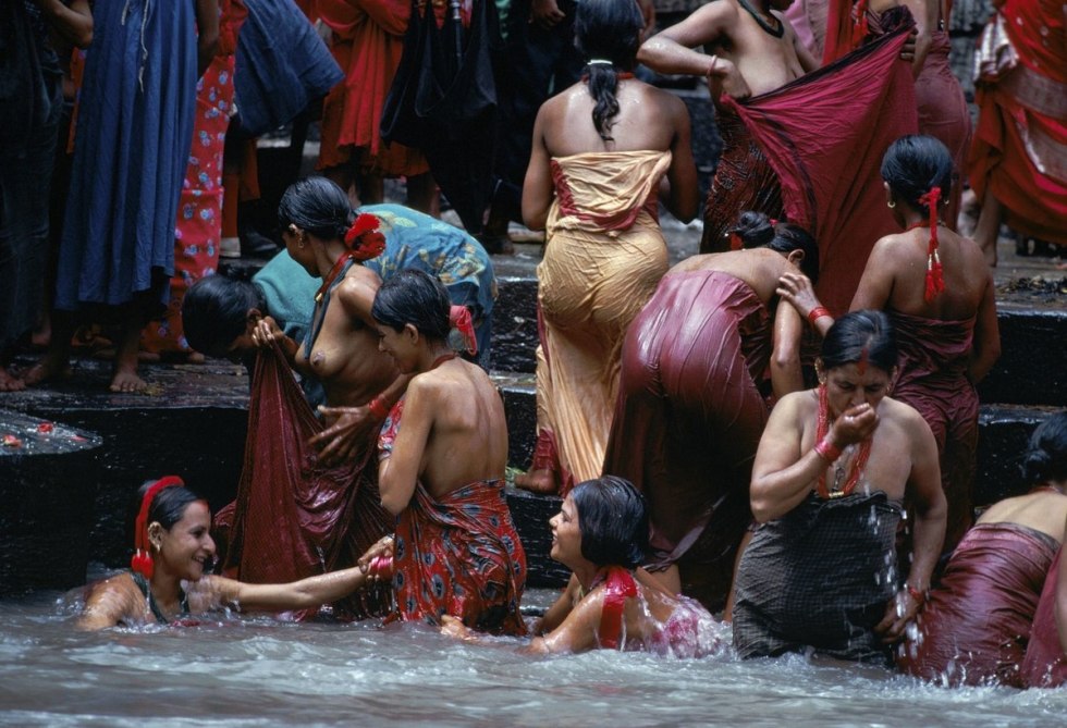 Indian women bathe