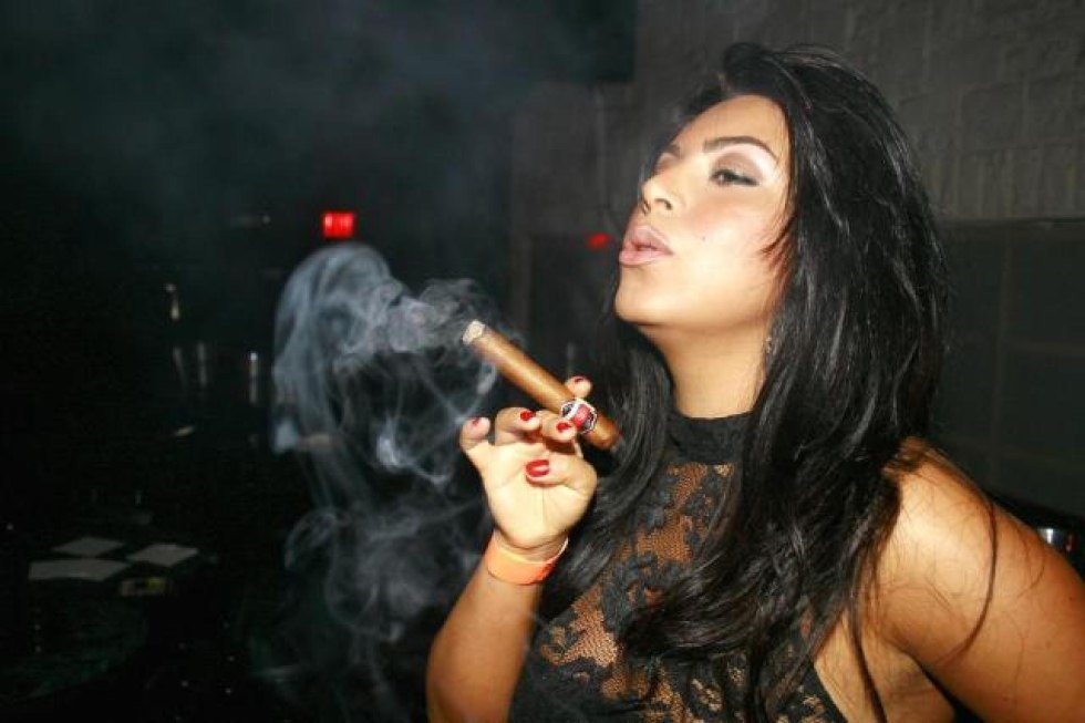 A woman smoking a cigar