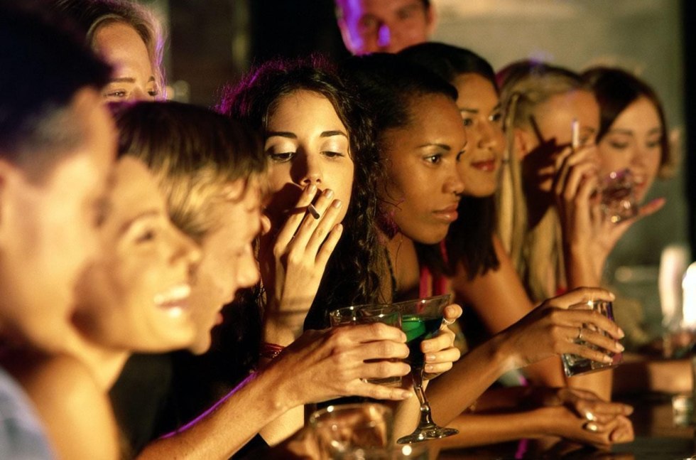 Smoking girl at a party
