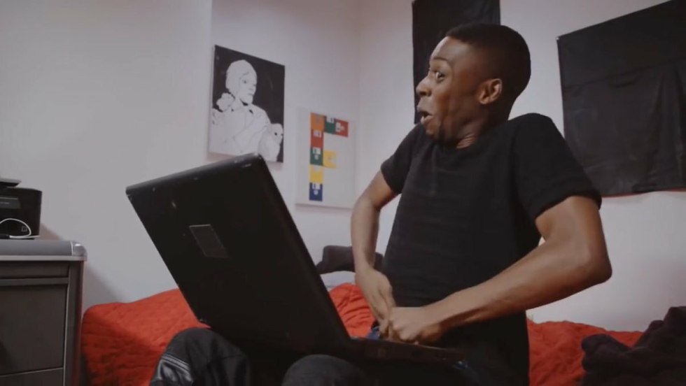 Negro with a hand in pants