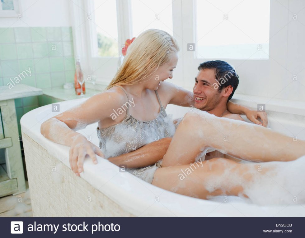 Naked Shameless Woman Washing in the Bath Among Men