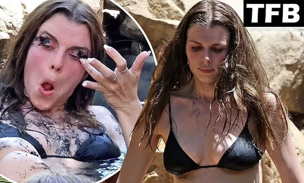 Man in the bath in clothes