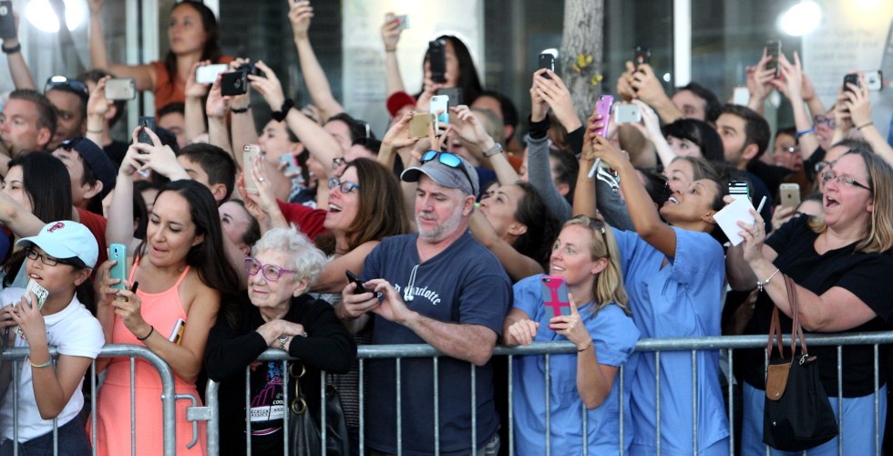 A crowd of people with phones