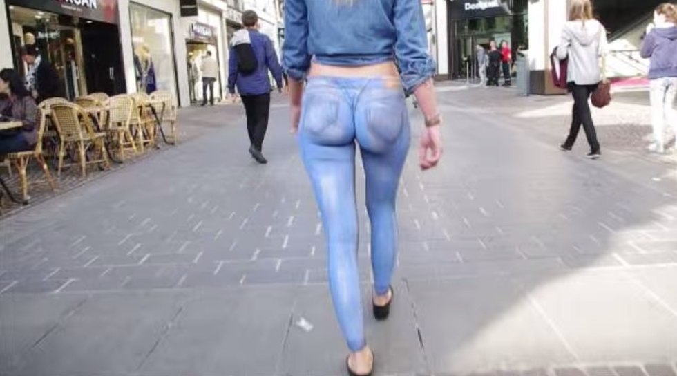Girl walks in painted jeans