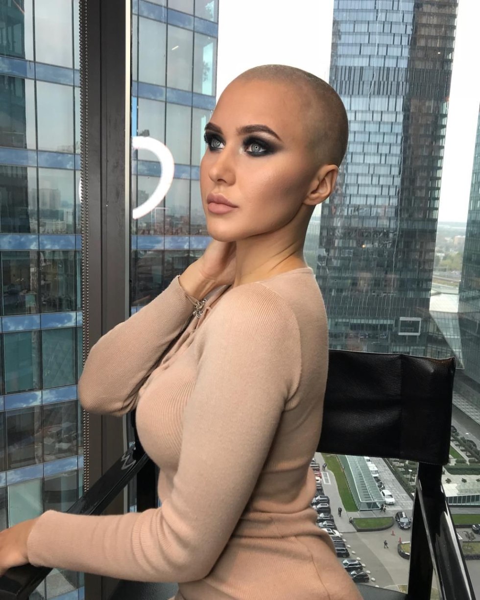 Naked with a shaved head