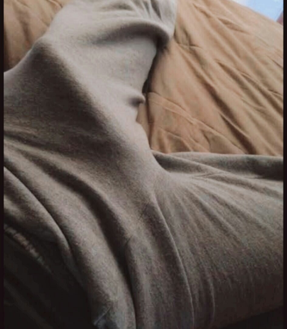 Girl under a blanket at night