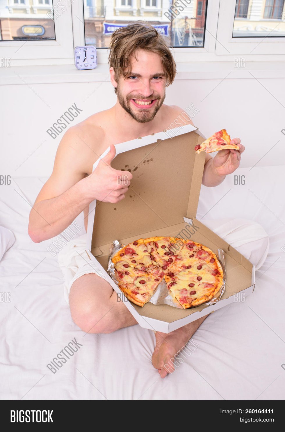 Handsome man with pizza