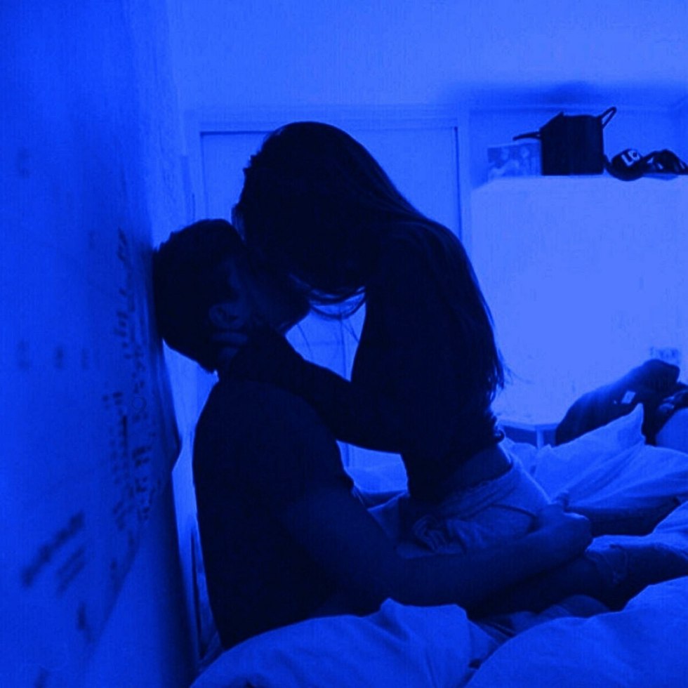 A guy with a girl in the dark