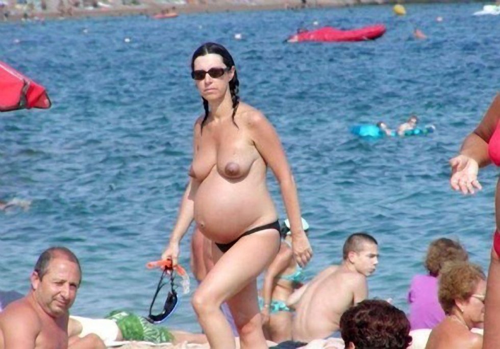 Pregnant women on a nudic beach