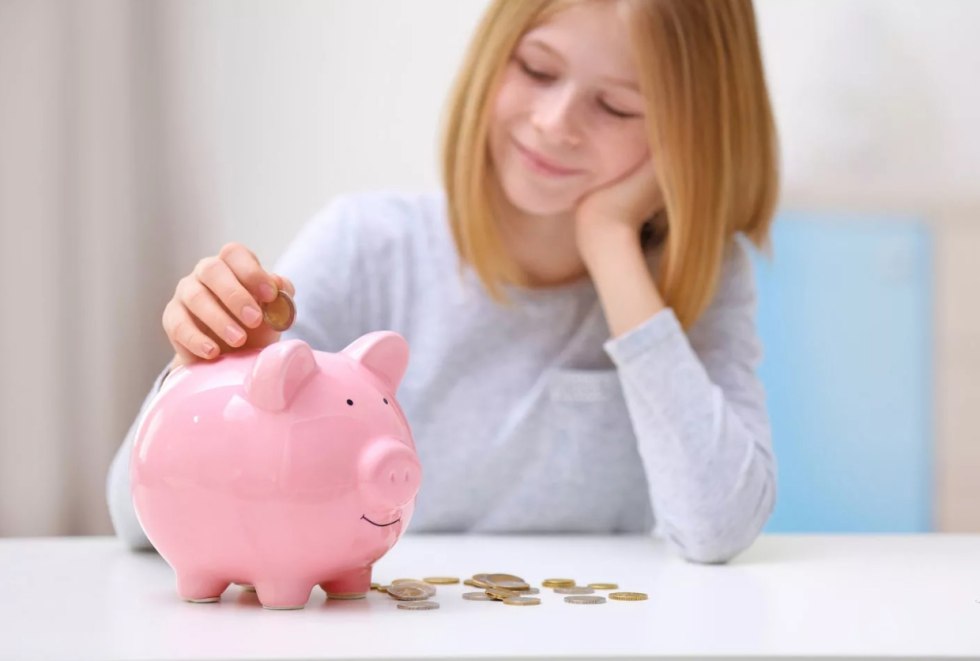 A woman with a piggy bank