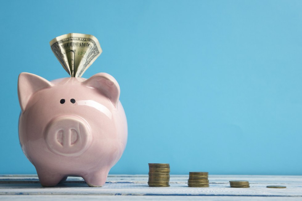 A little man with a piggy bank