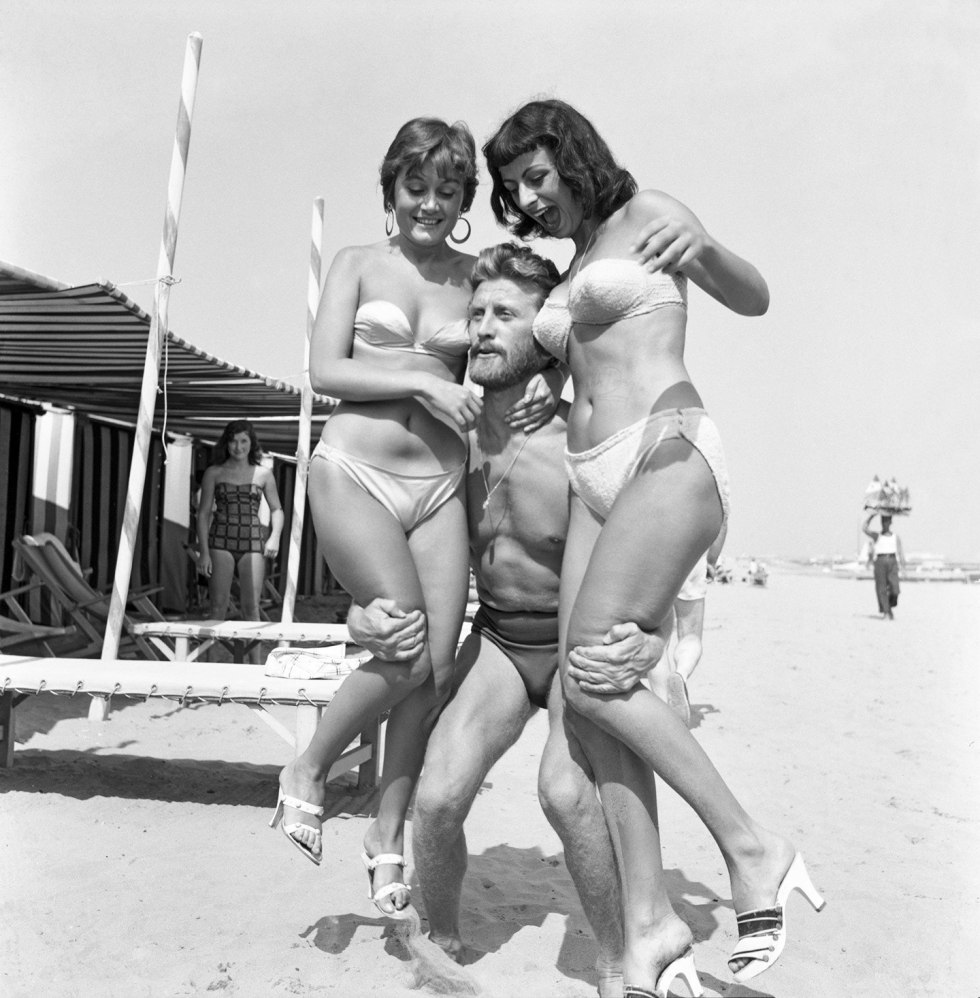 Girls with parents on the beach