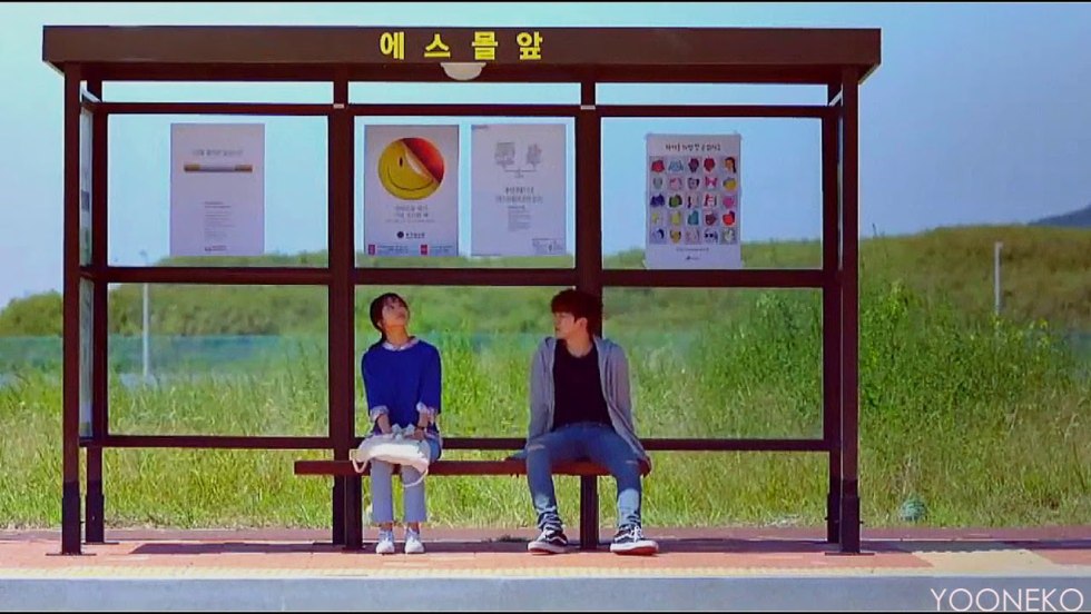 Bus stop with people