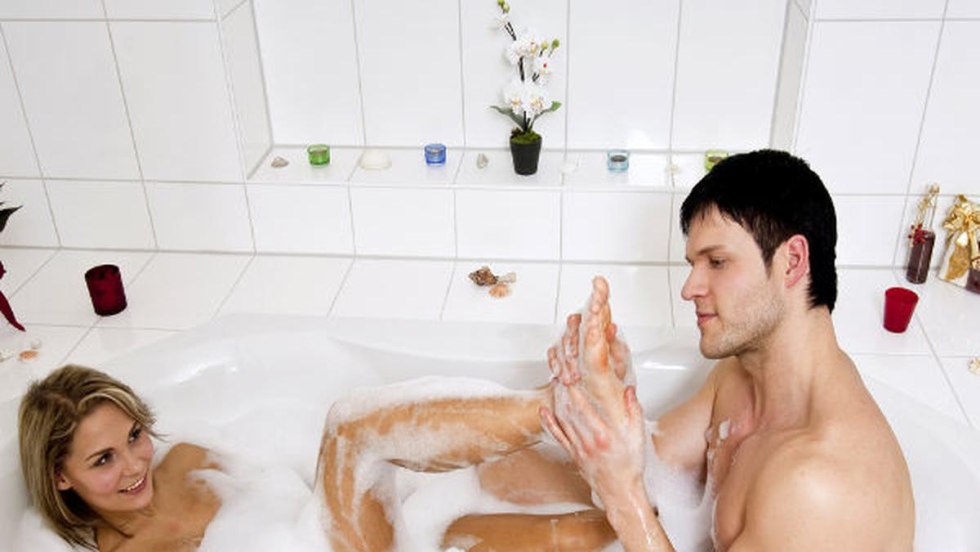 Beautiful girl washes in the bathroom