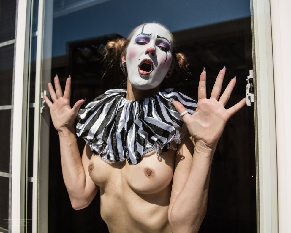 Naked women in makeup clowns