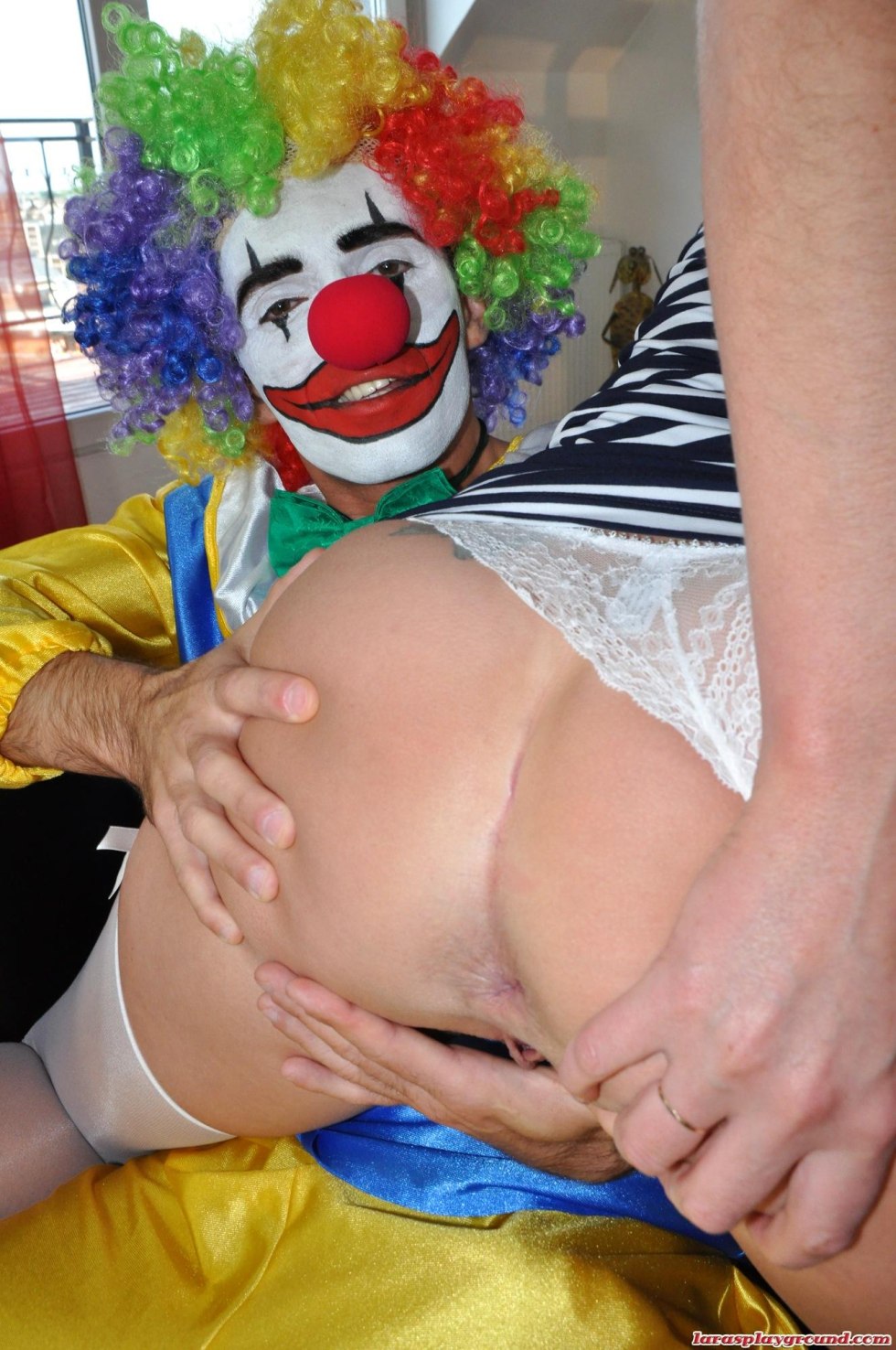 Naked women in makeup clowns