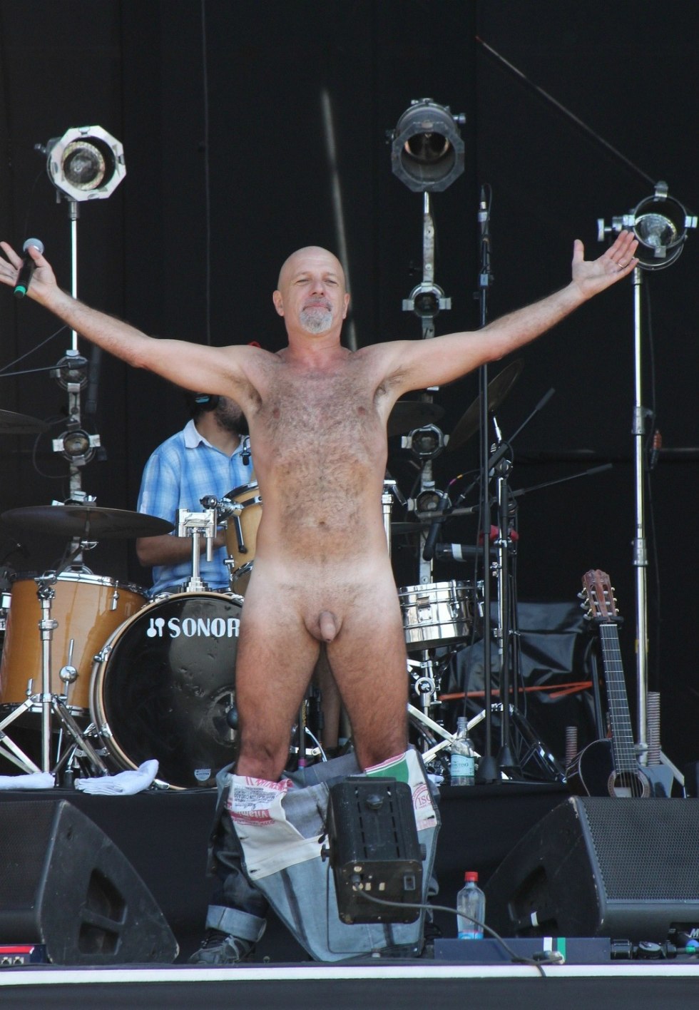 Naked rock musicians on stage