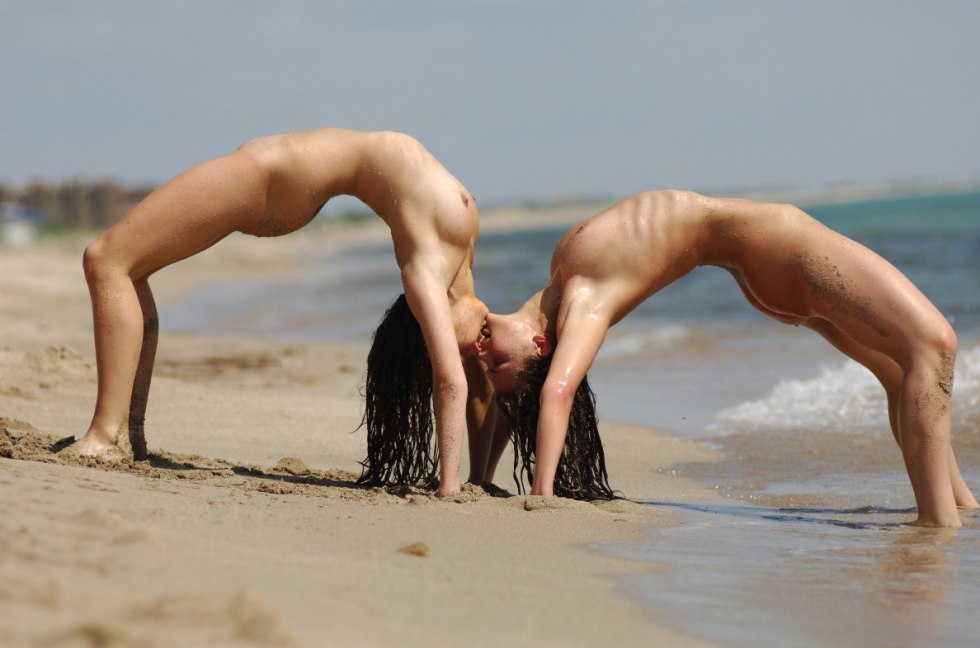 Naked gymnasts on the shore