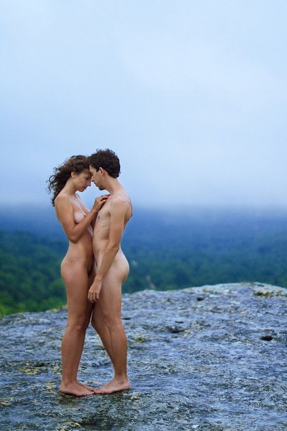 Naked men and women in nature