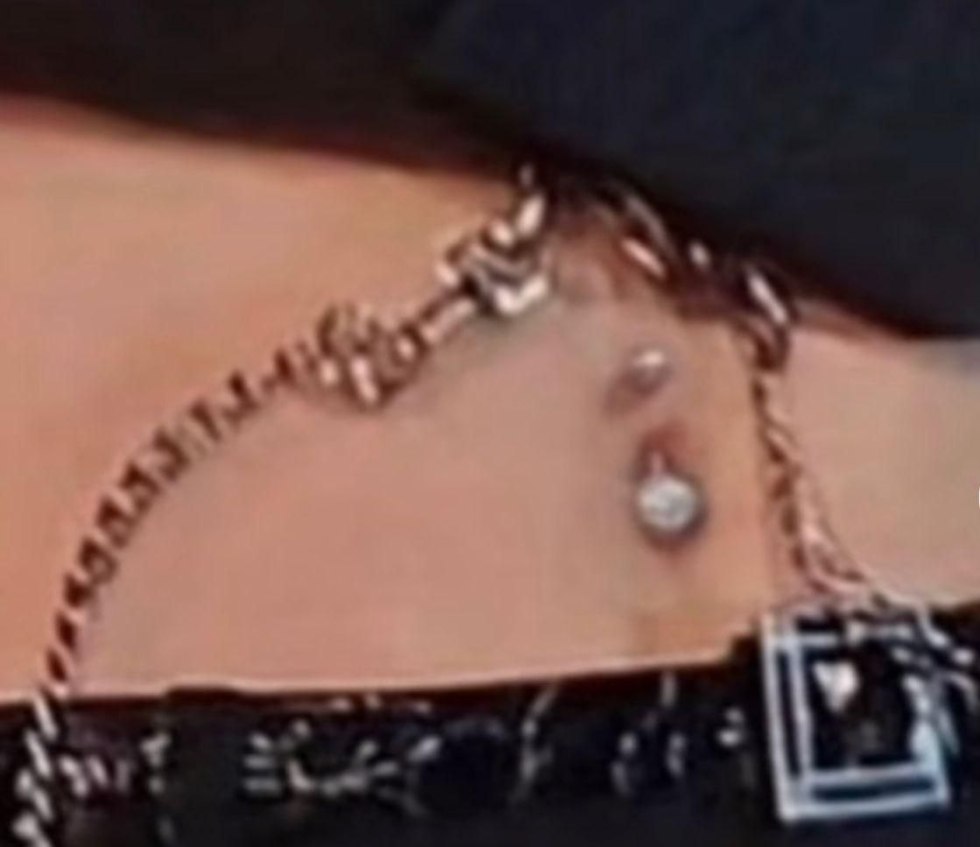 Girls piercing the perineum