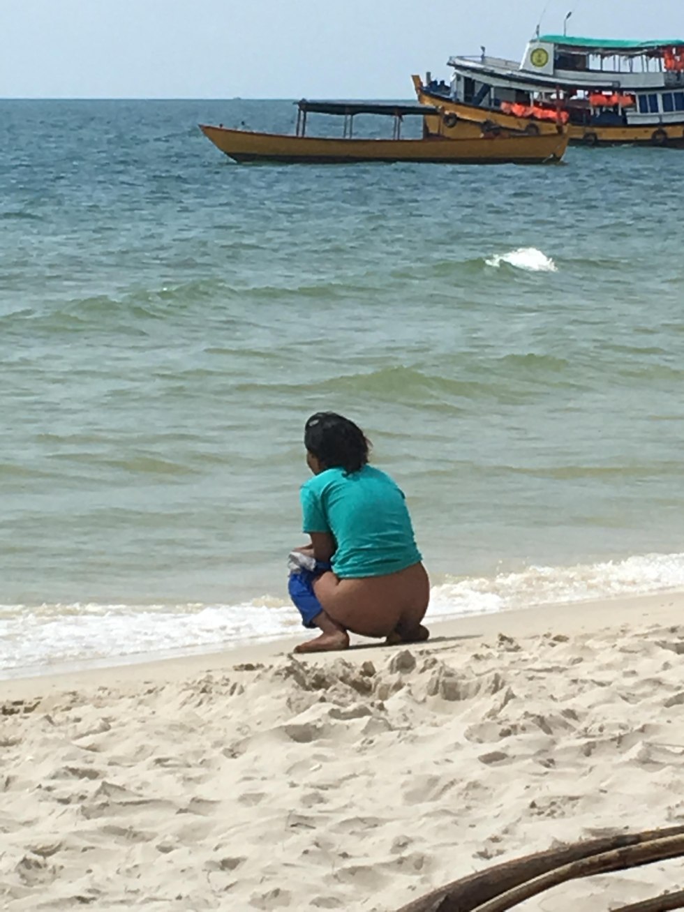 The girl was sleeping on the beach