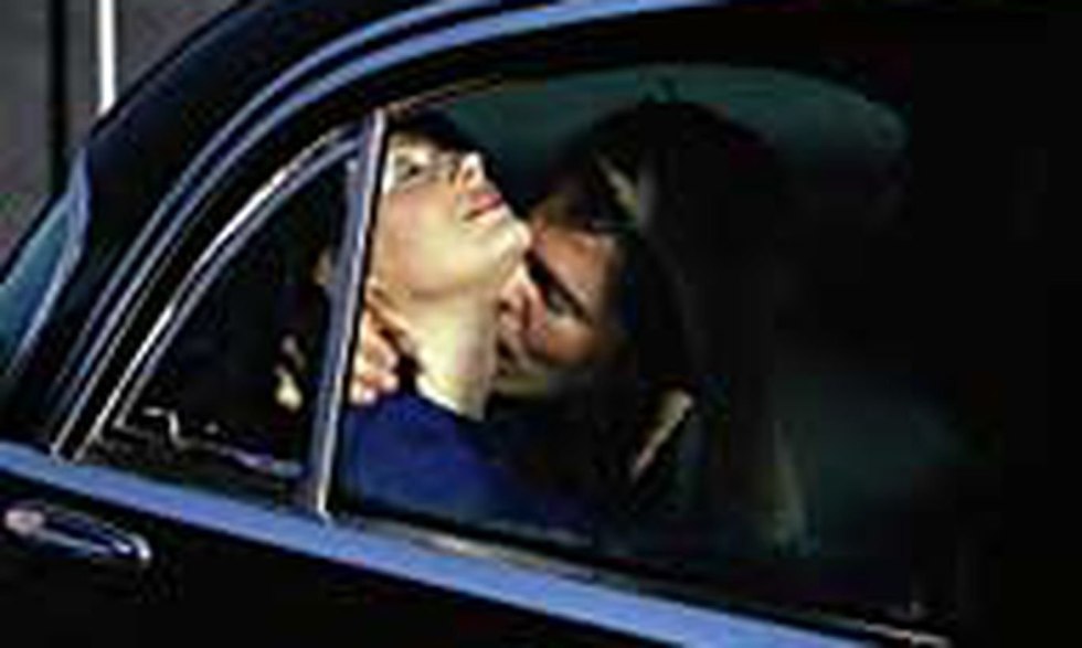 Girl in a car with thrown legs