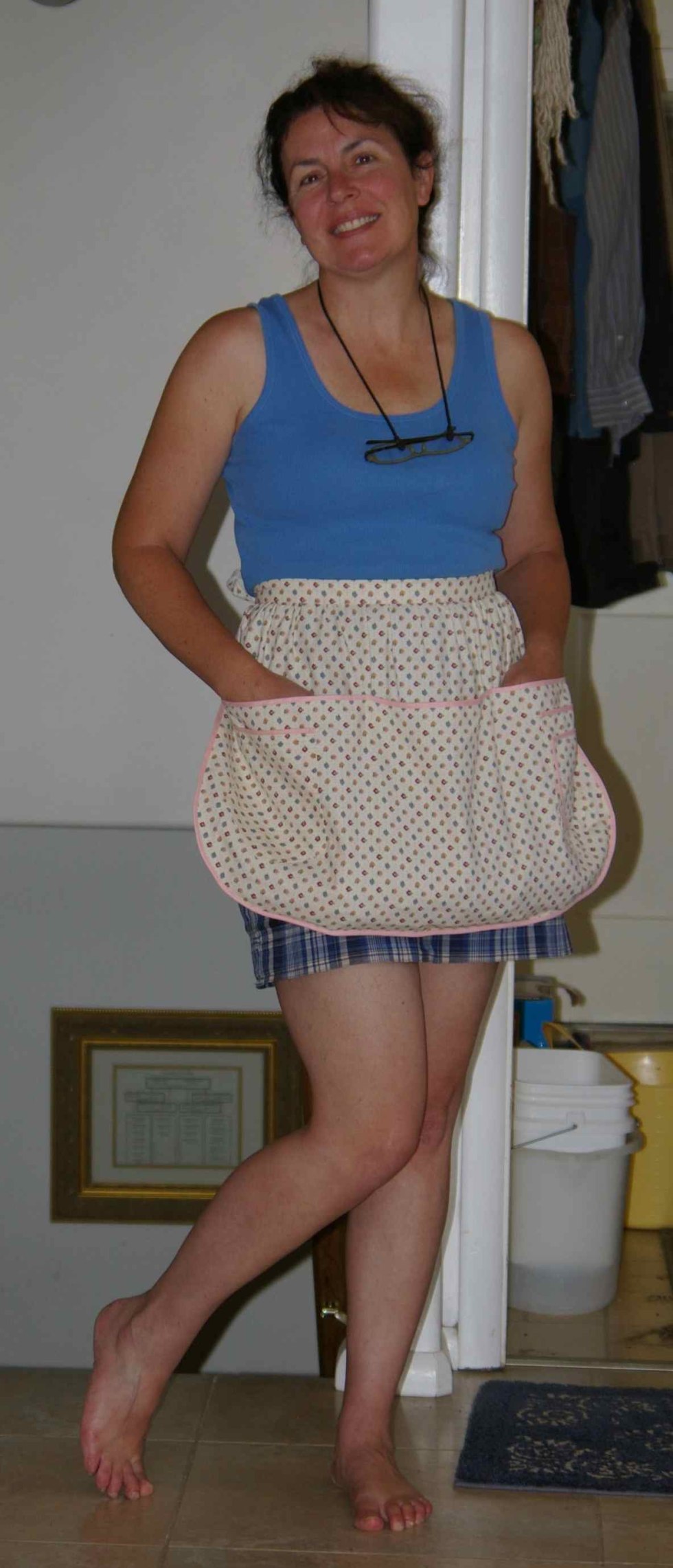 Girl in a apron in the kitchen