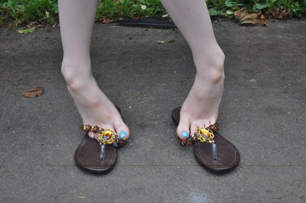 Female feet in the sandals of pedicure