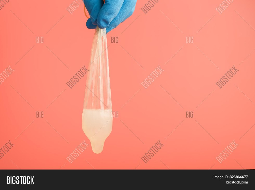 Male penis in condom