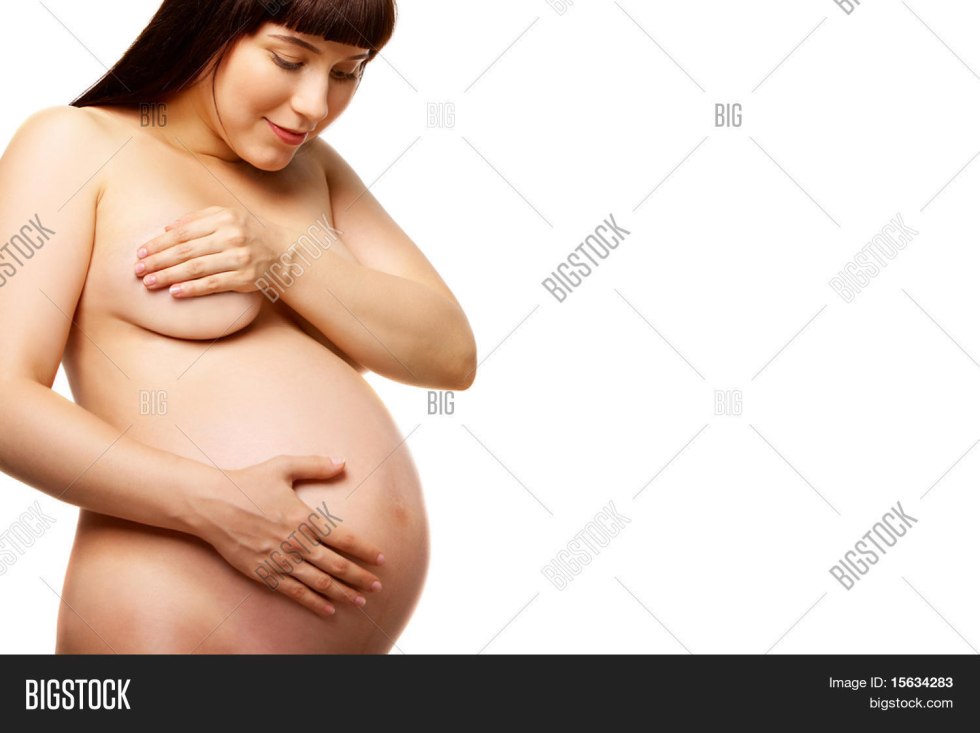 Pregnant in underwear on the bed