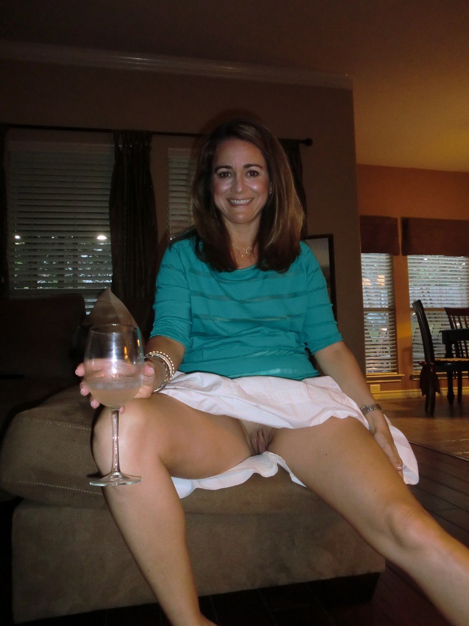 An elderly woman without panties under a skirt