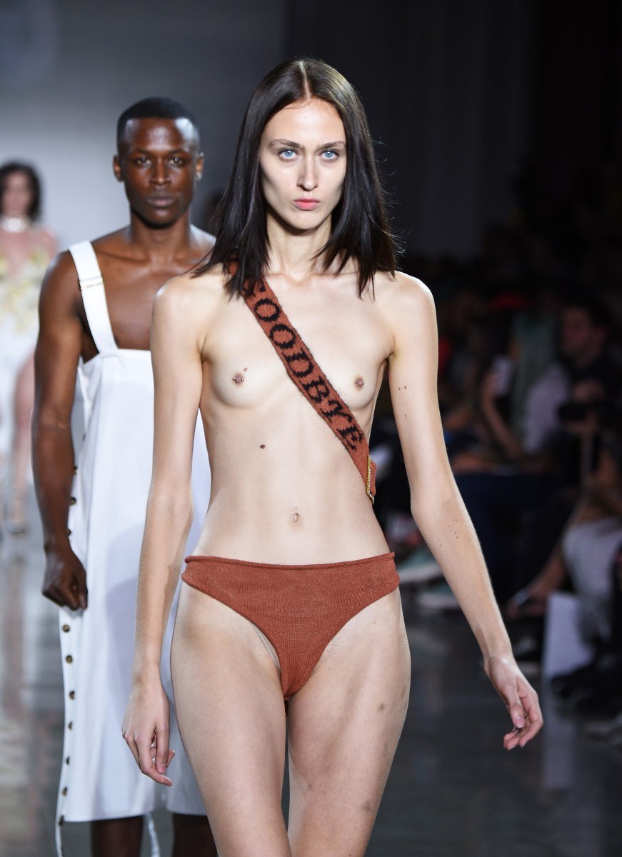 Shalom Harlow with bare breasts at a fashion show