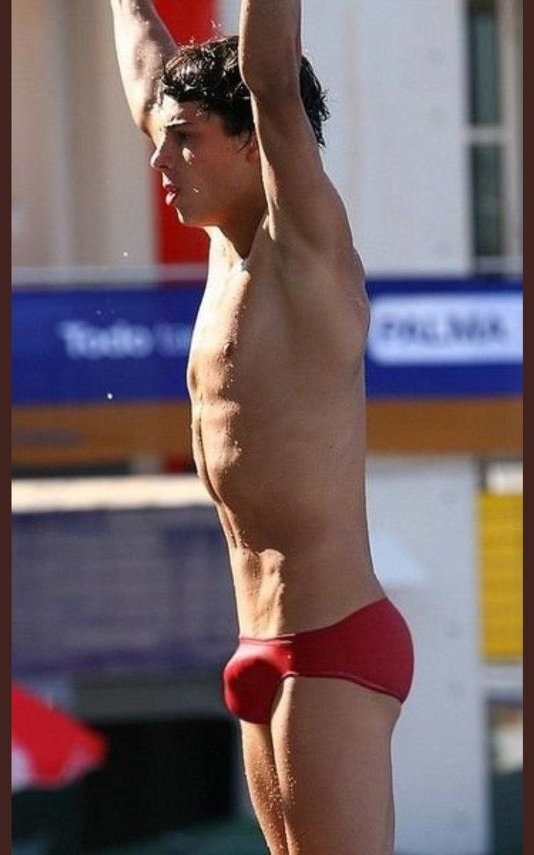 Men in swimming trunks in the pool