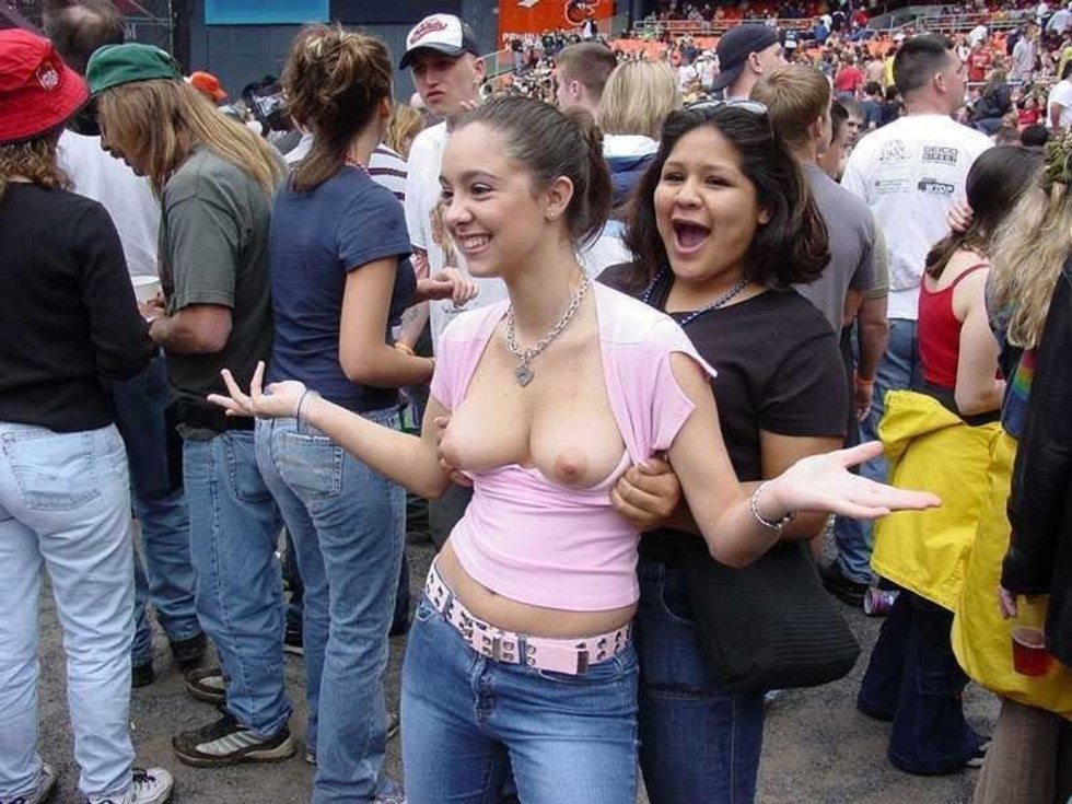 The girl shows her breasts in public