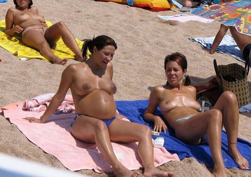 Pregnant nudist on the beach